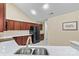 Well-lit kitchen with stainless steel appliances, dark cabinets, and quartz countertops at 808 Wynnshire Dr # A, Hickory, NC 28601