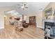Cozy living room with wood floors, ceiling fan, fireplace, and comfortable seating at 808 Wynnshire Dr # A, Hickory, NC 28601