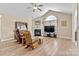 Living room features vaulted ceiling, fireplace, and hardwood floors at 808 Wynnshire Dr # A, Hickory, NC 28601