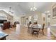 Open floor plan with dining area and living room featuring wood floors and natural light at 808 Wynnshire Dr # A, Hickory, NC 28601
