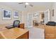 A home office with great lighting and french doors leading to the dining room at 808 Wynnshire Dr # A, Hickory, NC 28601