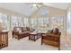 Inviting sunroom filled with lots of windows and comfortable seating area at 808 Wynnshire Dr # A, Hickory, NC 28601