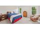 Comfortable bedroom with natural light, featuring classic decor and ample space for relaxation and rest at 820 Hampshire Hill Rd # 106, Matthews, NC 28105