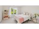 Inviting bedroom with soft, natural light, a neutral color scheme, and cozy bedding for ultimate relaxation at 820 Hampshire Hill Rd # 106, Matthews, NC 28105