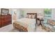 Comfortable bedroom with hardwood floors, lamps, and matching dresser at 820 Hampshire Hill Rd # 106, Matthews, NC 28105