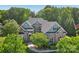 Charming two-story brick home with lush landscaping and a welcoming front entrance at 820 Hampshire Hill Rd # 106, Matthews, NC 28105