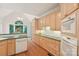 Open concept kitchen boasts updated appliances, sink, and ample countertop space at 820 Hampshire Hill Rd # 106, Matthews, NC 28105