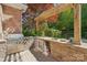 Outdoor kitchen featuring a built-in grill, countertop space, and convenient storage at 820 Hampshire Hill Rd # 106, Matthews, NC 28105