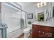 Cozy bathroom featuring glass enclosed shower, vanity with sink and tiled floors at 9332 Whistling Straits Dr, Fort Mill, SC 29707