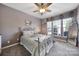 Bedroom featuring a large window, carpet floors, and nice furniture at 9332 Whistling Straits Dr, Fort Mill, SC 29707