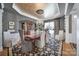 Formal dining room featuring elegant decor, a chandelier, and a large window for natural light at 9332 Whistling Straits Dr, Fort Mill, SC 29707