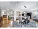 Open concept dining room featuring modern lighting and is adjacent to a cozy living room at 9332 Whistling Straits Dr, Fort Mill, SC 29707