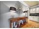 Stylish entryway featuring a decorative console table, lamps, and a unique mirror at 9332 Whistling Straits Dr, Fort Mill, SC 29707