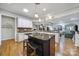 Open kitchen design with island seating, modern appliances, and an inviting atmosphere at 9332 Whistling Straits Dr, Fort Mill, SC 29707