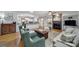 An inviting living room seamlessly connecting with the kitchen and showcasing a warm fireplace at 9332 Whistling Straits Dr, Fort Mill, SC 29707