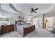 Serene main bedroom features tray ceiling, an ensuite bathroom, and a spacious layout with natural light at 9332 Whistling Straits Dr, Fort Mill, SC 29707