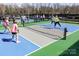 Well-maintained pickleball courts with players enjoying a game in a lively community atmosphere at 9332 Whistling Straits Dr, Fort Mill, SC 29707