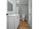 Well-lit bathroom featuring a modern vanity, clean fixtures, and stylish flooring at 97 Central Ave, China Grove, NC 28023