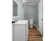 Well-lit bathroom featuring a modern vanity, clean fixtures, and stylish flooring at 97 Central Ave, China Grove, NC 28023