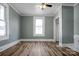 Inviting bedroom featuring wood-look floors, natural light, and neutral-colored walls at 97 Central Ave, China Grove, NC 28023
