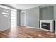 Inviting living room with a fireplace and modern floors at 97 Central Ave, China Grove, NC 28023