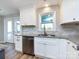 Renovated kitchen with granite countertops, stainless appliances, and ample cabinet space at 9921 Ridgemore Dr, Charlotte, NC 28277