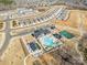 An aerial view of a community featuring a pool, clubhouse, tennis courts, and walking trails at 1113 Idyllic Ln, Waxhaw, NC 28173