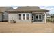 The home features a cozy backyard with an outdoor patio area, ideal for entertaining at 1113 Idyllic Ln, Waxhaw, NC 28173
