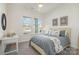 Bedroom bathed in natural light from two large windows, neutral paint, and a ceiling fan at 1113 Idyllic Ln, Waxhaw, NC 28173