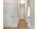 Bright entryway featuring wood-look flooring, white walls, and views into other rooms in the house at 1113 Idyllic Ln, Waxhaw, NC 28173