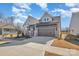 New construction with gray siding, a two-car garage, and a driveway that provides ample parking at 1113 Idyllic Ln, Waxhaw, NC 28173