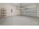 Spacious two-car garage with epoxy flooring and ample room for vehicles and storage at 1113 Idyllic Ln, Waxhaw, NC 28173