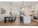 Spacious kitchen with a large center island, stainless steel appliances, and a dining area at 1113 Idyllic Ln, Waxhaw, NC 28173