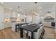 Open kitchen and dining area with pendant lighting, a large island, and stainless steel appliances at 1113 Idyllic Ln, Waxhaw, NC 28173
