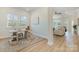 Bright, neutral office space featuring wood-look floors and views of the living room at 1113 Idyllic Ln, Waxhaw, NC 28173