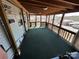 Spacious deck with wooden beams and green carpet at 113 Cedar Ln, New London, NC 28127