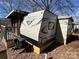 Exterior of home with deck and camper at 113 Cedar Ln, New London, NC 28127