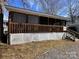 Exterior of home with screened in porch and deck at 113 Cedar Ln, New London, NC 28127