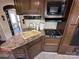 Well-equipped kitchen with stainless steel appliances, ample counter space, and modern fixtures at 113 Cedar Ln, New London, NC 28127