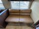 Close-up of a comfortable leather couch with plush cushions in a cozy setting at 113 Cedar Ln, New London, NC 28127