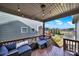 Inviting covered back porch with comfortable seating, perfect for relaxation and outdoor enjoyment at 117 Stowe Rd, Belmont, NC 28012