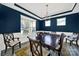 Dining room with elegant lighting, wainscoting, and ample natural light at 117 Stowe Rd, Belmont, NC 28012