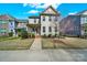 Charming two-story home featuring a welcoming front porch and well-manicured landscaping at 117 Stowe Rd, Belmont, NC 28012