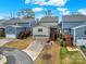 Aerial view of homes in a suburban neighborhood, highlighting garages and backyard decks at 117 Stowe Rd, Belmont, NC 28012