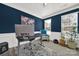 Office with custom shelving, stylish decor, and ample natural light at 117 Stowe Rd, Belmont, NC 28012