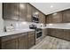 Modern kitchen with stainless steel appliances, ample cabinetry, and sleek countertops, creating an inviting cooking area at 117 Stowe Rd, Belmont, NC 28012