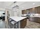 Bright kitchen showcasing a spacious island with seating, pendant lighting, and modern appliances for culinary enthusiasts at 117 Stowe Rd, Belmont, NC 28012