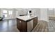 Kitchen island with stainless steel dishwasher and sink, offering a functional and stylish culinary space at 117 Stowe Rd, Belmont, NC 28012