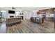 Open-concept living space featuring a stylish kitchen island and comfortable seating area for relaxation and entertainment at 117 Stowe Rd, Belmont, NC 28012
