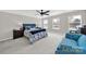 This spacious main bedroom features a ceiling fan and lots of natural light from the many windows at 117 Stowe Rd, Belmont, NC 28012